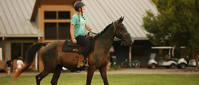Girl riding horse