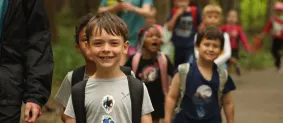 child smiling at camp