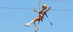 camper on zipline