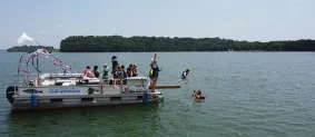 kids swimming in lake