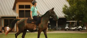 Girl riding horse